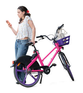 cut out woman with a phone standing by a rental bike