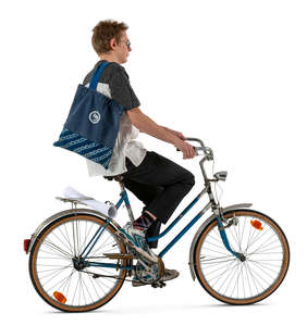 profile view of a young man riding a bike