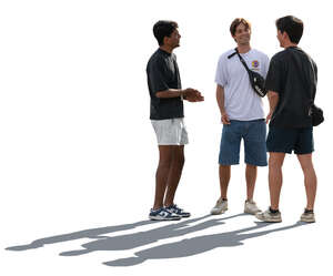 backlit multinational group of boys standing