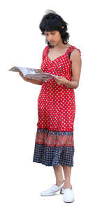 indian woman standing and reading a magazine