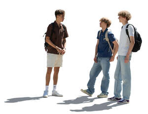 cut out backlit group of teenage boys standing and talking