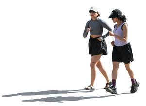 backlit women jogging in the street