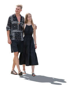cut out backlit couple walking on a warm summer day