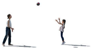 japanese woman and her daughter playing with a ball 