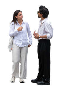 man and woman in white shirts standing and talking