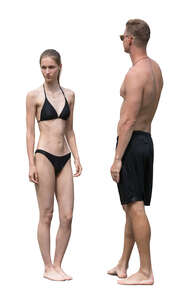 man and woman in bathing suits standing
