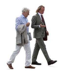 two senior businessmen walking and talking