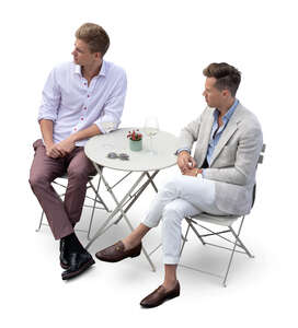 two men sitting in a restaurant seen from above
