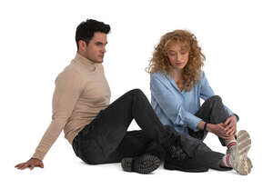 man and woman sitting on the floor together