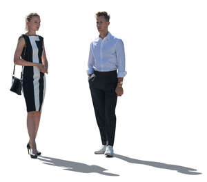 backlit man and woman standing and talking
