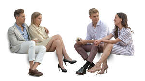 two couples sitting and talking