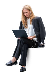 young businesswoman sitting with laptop and having a conference call