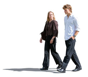two sidelit people walking