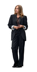 young woman in a black suit standing
