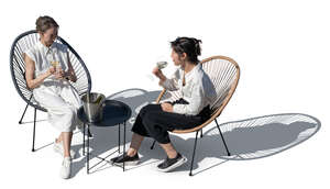 two asian women sitting in a fancy cafe seen from above