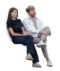 man and woman sitting side by side