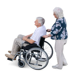 top view of an elderly woman helping a man in a wheelchair