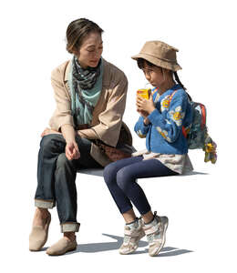 asian woman and child sitting together and talking