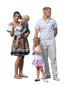 family with little children standing and looking around