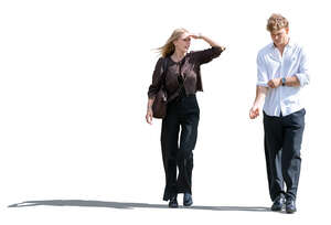 young man and woman walking and looking around