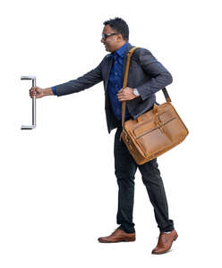 indian businessman opening a door