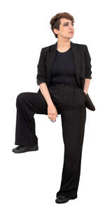 woman in a black suit standing
