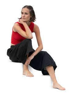 woman in black and red outfit sitting