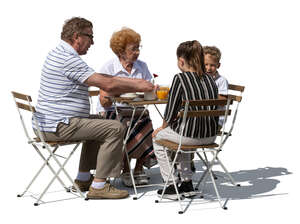 grandparents sitting in a cafe with their grandkids