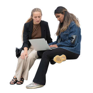 two female friends looking at a computer together