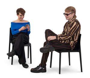 man and woman sitting and smiling