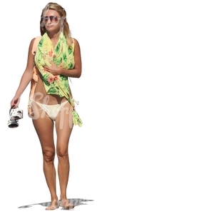 woman in a bikini standing barefoot