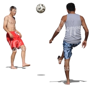 two men playing football at the beach
