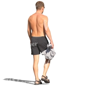 man in swimming pants walking