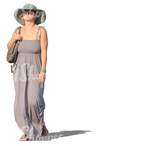 woman with a large hat walking in resort