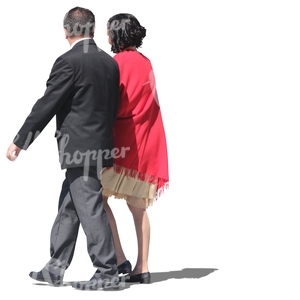 fancy couple walking arm in arm