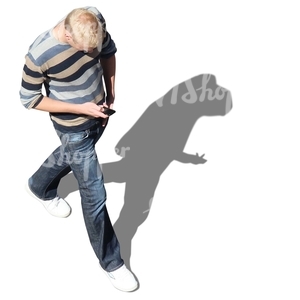 blond man walking seen from above