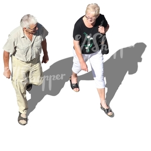 elderly man and woman walking