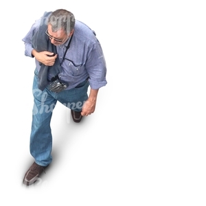 man with a camera walking