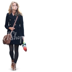 woman in a black coat walking