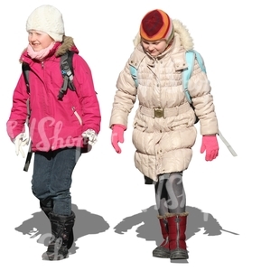 two girls with schoolbags walking in winter