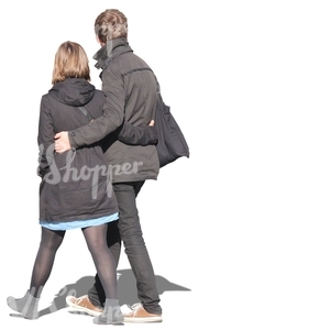 couple in black coats walking arm in arm
