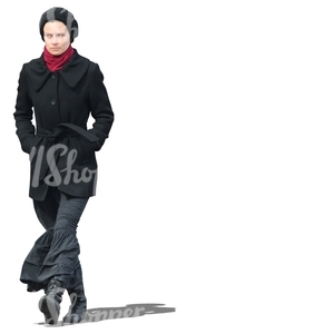 woman with a black coat and skirt walking