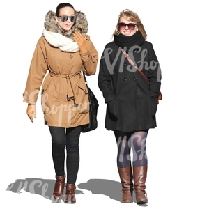 two smiling women walking together