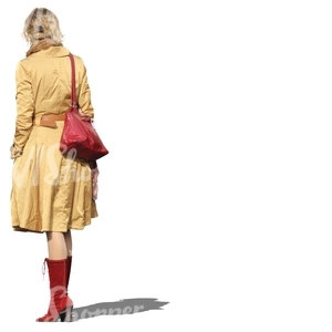 cut out woman in a yellow coat standing