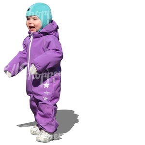 child in a purple onsie standing