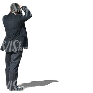 cut out man in a suit taking a picture