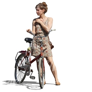 cut out woman in a dress standing by a bicycle
