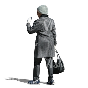 cut out woman in a grey winter coat walking