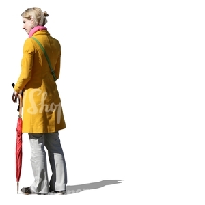 cut out woman in a yellow coat standing