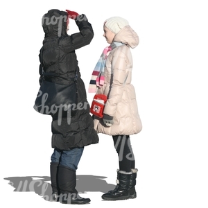 two cut out women in winter coats talking